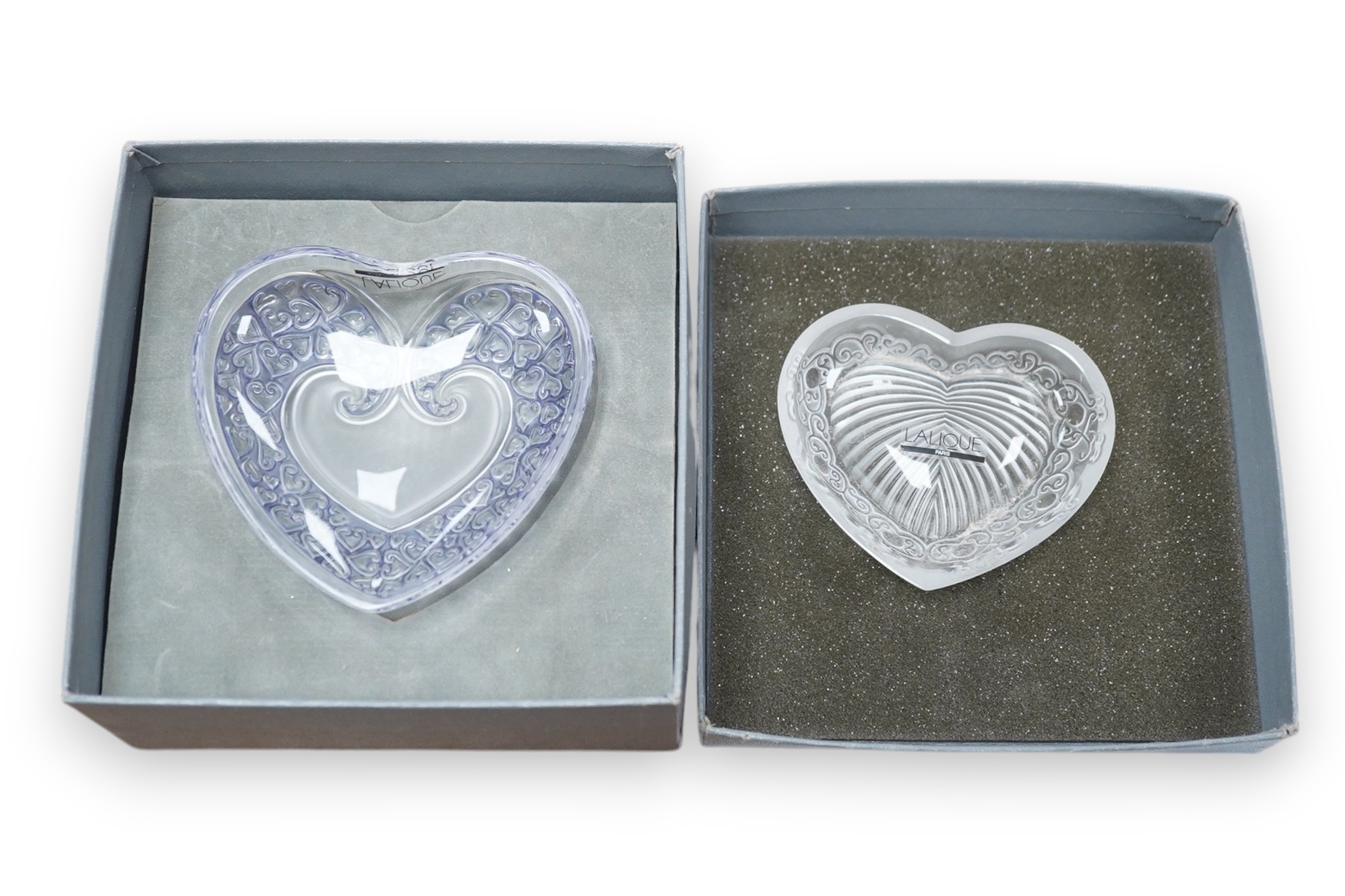 Two modern Lalique glass pin dishes in the form of hearts, largest 11cm wide. Condition - good